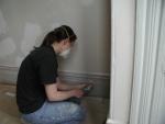 Emily scraping woodwork