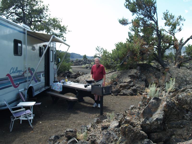 Grilling hot dogs at Craters of the Moon Campground
