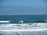 A surfer at Pacifica State Beach - Pacifica CA.