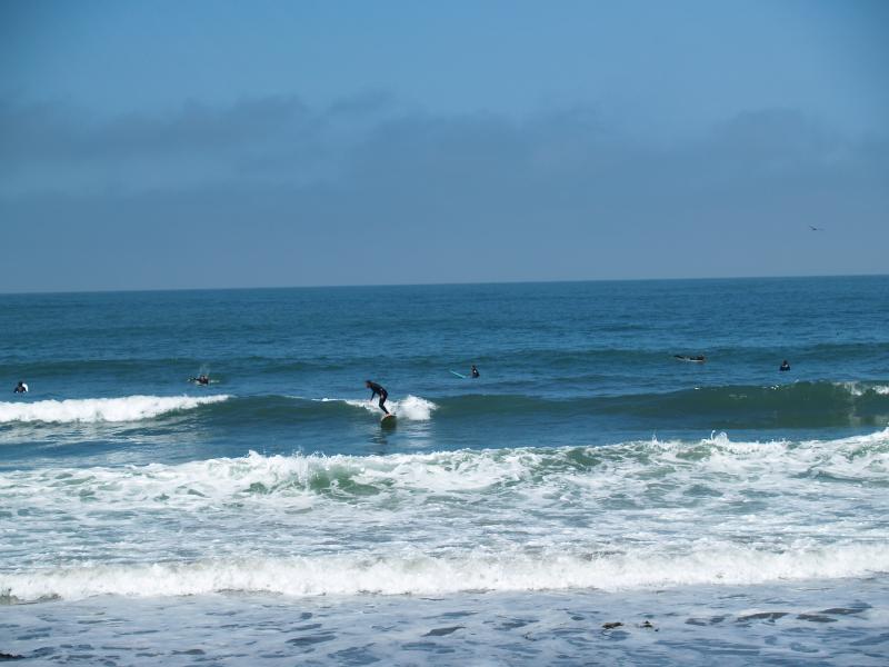 A surfer at Pacifica State Beach - Pacifica CA.
