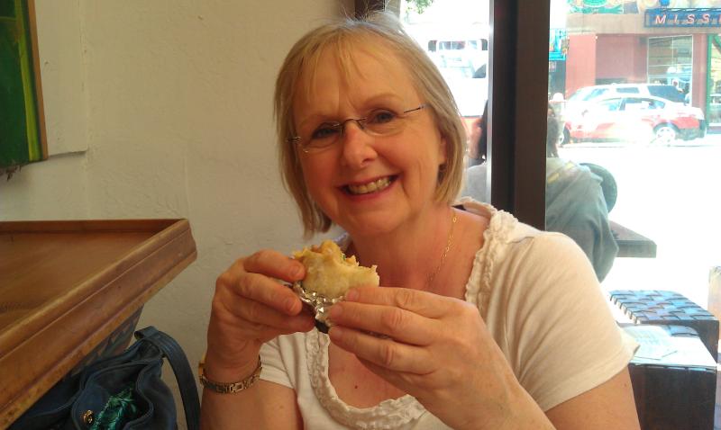 Bonnie is eating her burrito at La Taqueria in San Francisco