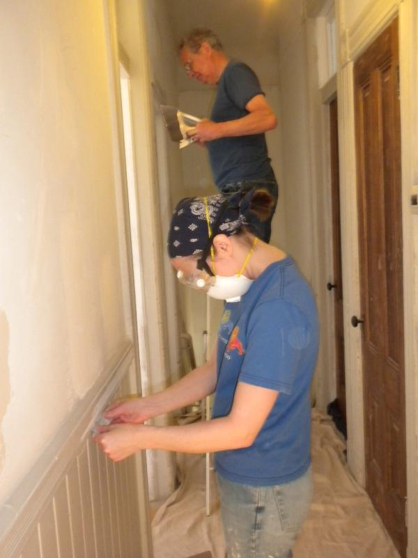 Emily and I sanding and plastering in Steve and Emily's hallway