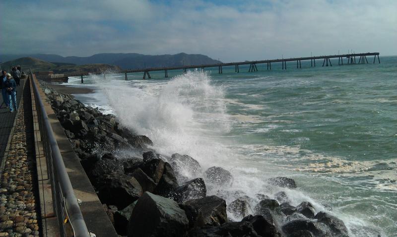 The surf rolls in down by the dock in Pacifica