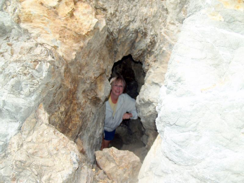 Bonnie hiding in a rock on the beach
