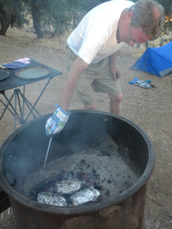 We made Hobo Dinners: ground beef patties, potatoes, carrots, squash, onion & garlic wrapped in foil and cooked on hot coals