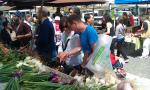 Steve and Emily discussing carrots at Farmers Market